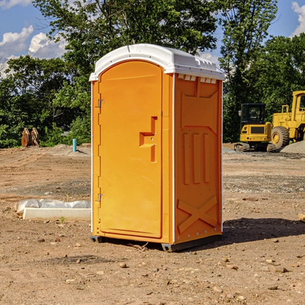 what is the cost difference between standard and deluxe portable toilet rentals in Russell KS